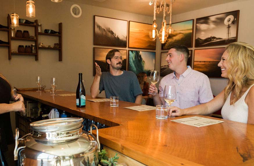 People tasting wine indoors